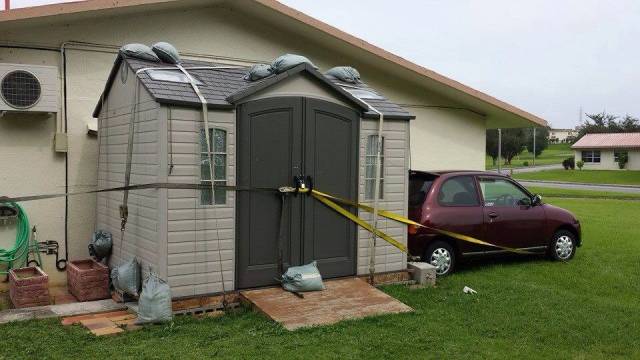 Japan typhoon-secure the car to the shed, and secure the shed to the house
