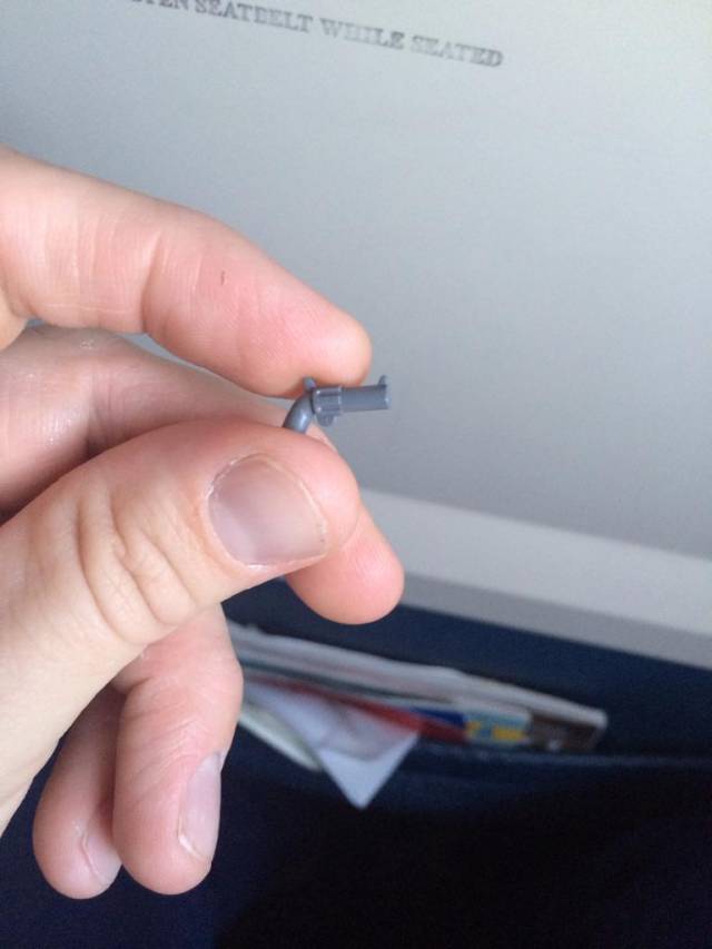 Found this lil guy on the floor of the airplane.....and to think I take off my belt and shoes and this piece still makes it through.