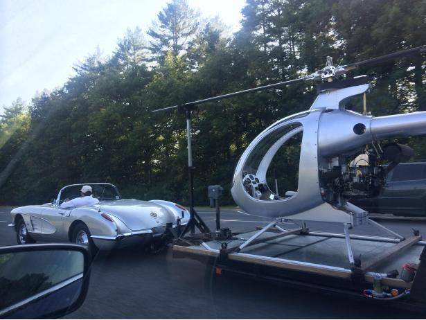 50′s corvette towing a helicopter. this guy is winning at life.