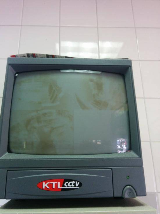 This security camera TV has been on so long the images of the store have been burned in.