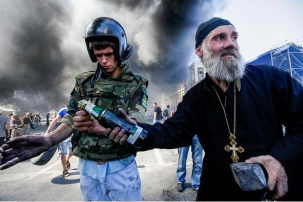 Kiev Today, even the priests are tossing Molotov’s.