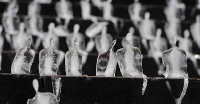 Artist Uses Melting Ice Sculptors To Commemorate The Dead