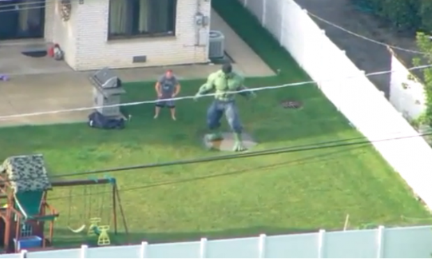 Recently our local news covered some flooding in a nearby town. This guy noticed the helicopter and rushed outside to pose with his hulk statue.