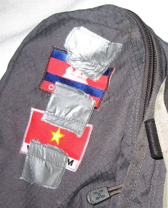I asked a seamstress in Thailand to sew flags on my backpack. I marked where I wanted the flags with duct tape. This is what I got.