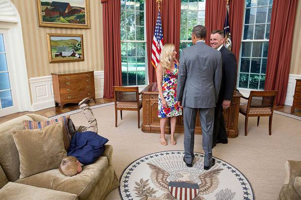 Bored kid faceplants himself in the Oval Office.