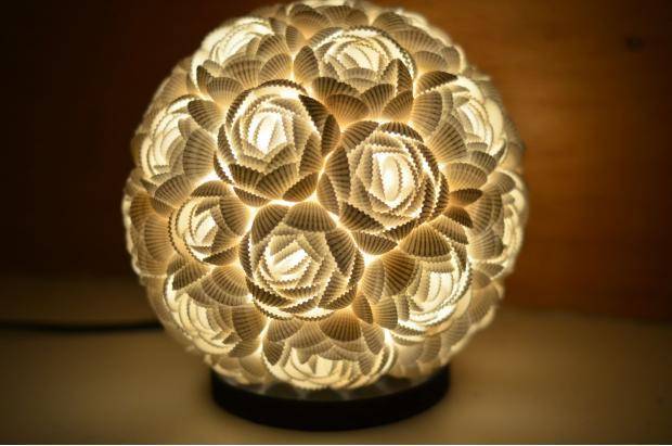 Yesterday I bought perhaps the prettiest table lamp in the world. It’s made of sea shells.