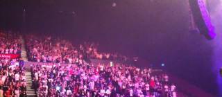 Kanye calls out a pair of fans for not standing up at the show. One had a prosthetic limb, and the other was in a wheelchair. [09/12/2014]