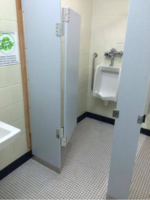 Urinal in my univeristy bathroom has it's own stall