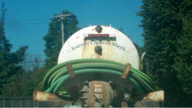 On the back of a septic pump truck