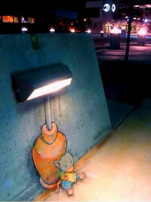 Mouse quietly reading under sidewalk lamp stand
