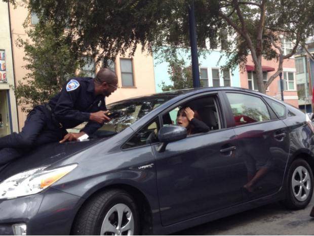Woman Drives Away With Parking Officer On Her Hood