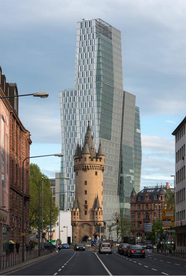 600-year-old tower in front of a modern high-rise in Frankfurt