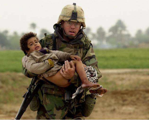 US Iraq war hero Joseph Dwyer. The iconic picture shows Dwyer carrying an injured Iraqi boy who he rescued from crossfire. After the war, Dwyer was diagnosed w/ PTSD. Faced w/ being jobless, marital breakdown, violent delusions. Dwyer later died of a drug overdose