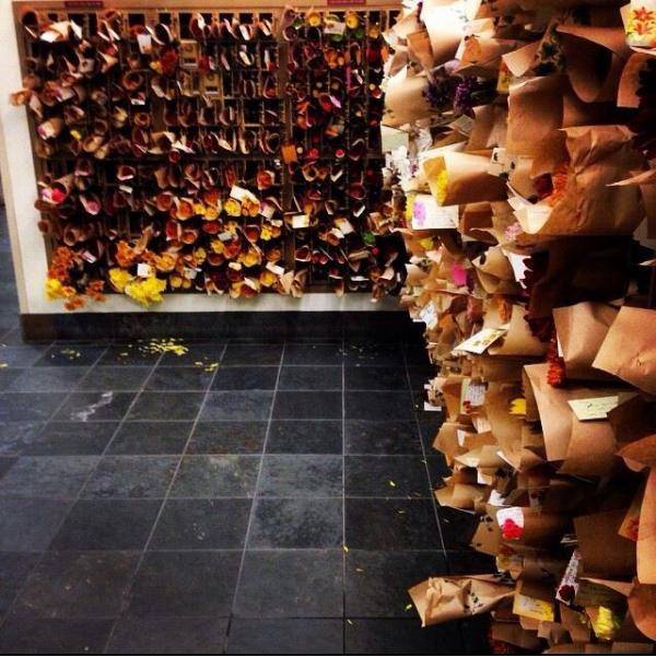 A girl recently passed away at the college in my town. The other college in town, Carleton sent every student at St. Olaf flowers. This is the mail room this morning.