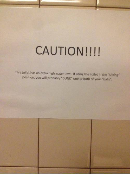 Sign in men's bathroom stall.
