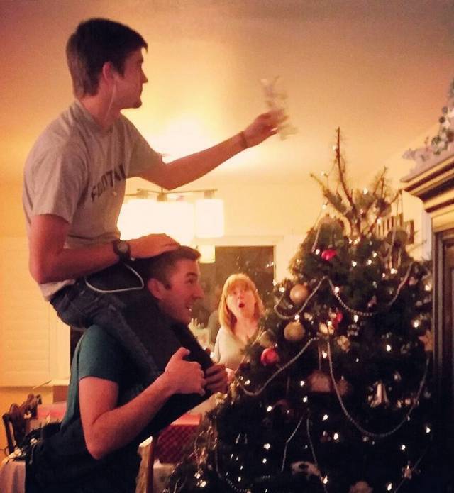 Every year, the older brother puts the younger brother on his shoulders to set the star on top of the Christmas tree. They've been doing it since they were kids. Now they're in their 20s..