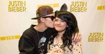 17 Hilariously Awkward Pictures Of Celebrities Posing With Fans