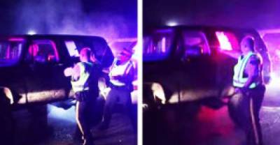 Watch: Crazy Guy at Police Check Point Gets Pepper Sprayed, Destroys 2 Police Cars and Then Flees!