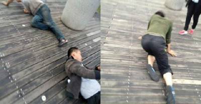 This Chinese Company Punishes Employees By Making Them Crawl On Their Knees Around A Lake