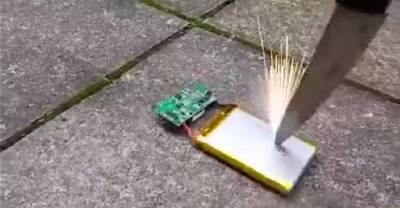 Watch What Happens When A Phone Battery Is Poked With A Knife... YOWZA!