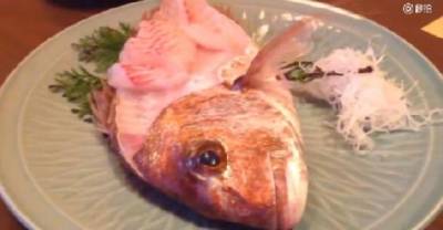 WTF! Half-Eaten Fish Comes Back To Life While A Woman Is Eating It