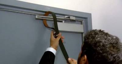 He Tightens His Belt Around The Door Hinge. This Could Save Your Life