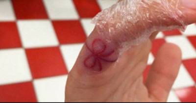 Red Strings Are Popping Up On People's Fingers. Here's What They Mean.
