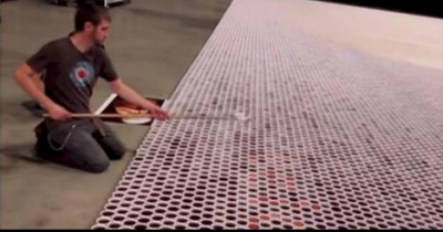 He Positioned 66000 Cups Full Of Water. When The Camera Zooms Out Everyone Is Blown Away.