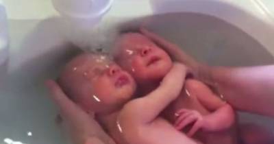 Newborn Twins Seen On Video Hugging Each Other During Bath