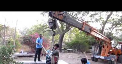 'When Unconditional Love Is Conditional' - A Man Hangs From Crane To Rescue A Dog Trapped In A Well.