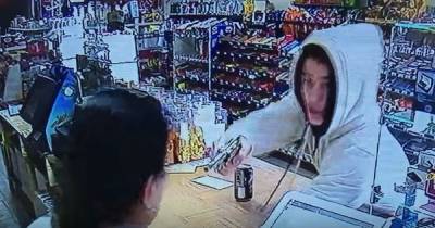 CCTV Shows Woman Cashier Fights Back Against Armed Robber With Bare Hands
