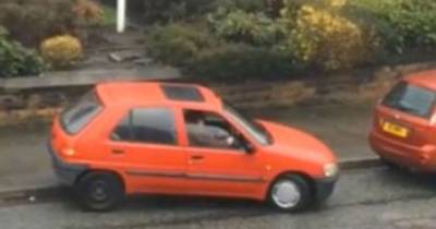 Frustrated Motorist Filmed Taking 7 MINUTES To Pull Car Out Of Tight Parking Spot On Busy Road