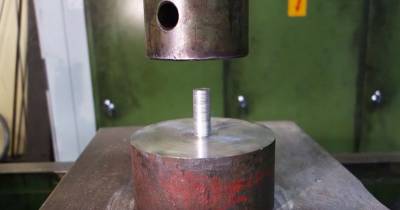 Watch What Happens When Coins Get Placed Under A Hydraulic Press