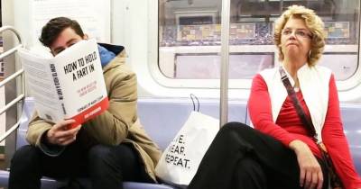 People React To Pranksters Fake Book Covers On The Subway