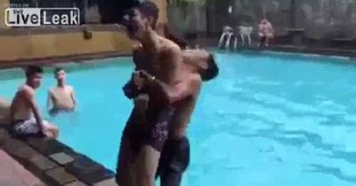 Horrifying Moment Teen Smashes His Head Against The Side Of A Pool As His Friend Bodyslams Him Into The Water