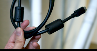 Why Your Laptop Needs That Cylinder On The Charging Cord