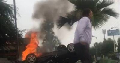 Incredible Footage Shows Hero Passer-By Risking His Own Life To Pull A Stranger From A Burning Car