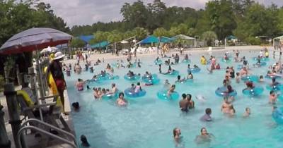 Would YOU Have Spotted Her? Dramatic Moment Lifeguard Dives In And Rescues Three-Year-Old Girl About To Drown