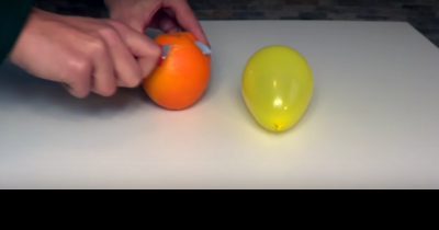 What Happens When You Spray A Balloon With An Orange Peel Is Crazy - And Surprising