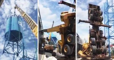 Crane Crashes Down After Failing To Lift A Water Tower