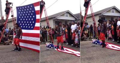 Lil Wayne Intentionally Disrespects The American Flag By Walking On It!