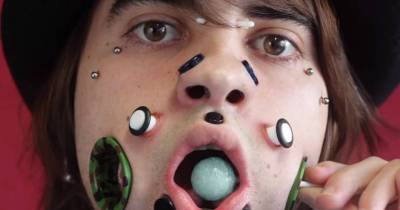 Body Artist Resembles A Zombie As He Creates Giant Flesh Tunnels In His Cheeks