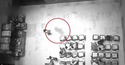 Watch As A Ghost Follows A Woman Out Of A Room, But No One Seems To Notice