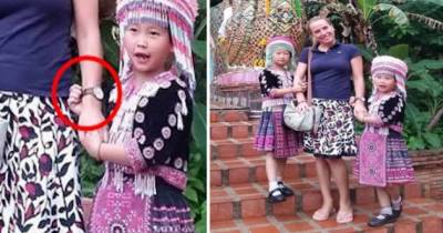 Two Tiny Thai Thieves In Traditional Attire Steal From A Female Tourist