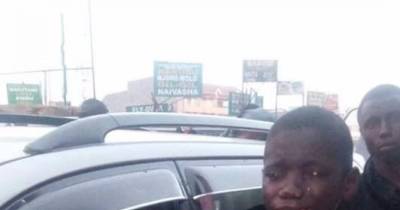 Homeless, Beggar Child Sees A Woman's Car Full Of Machines