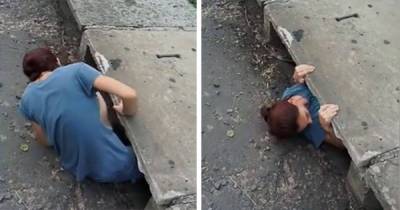 Lady Heard Sounds Coming From Sewer So She Checked It Out Then Climbed Inside To Help