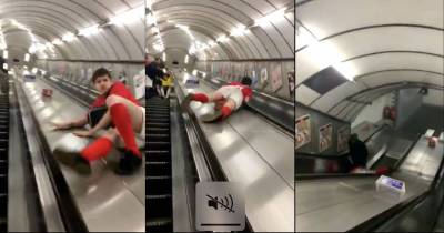 Guy Attempts To Slide Down An Escalator Gets Hit In Painful Place