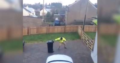 Wife Catches Hilarious Footage Of Her Husband's Showdown With Their Icy Driveway