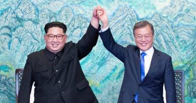 Kim-Jong Un Is All Smiles And Shaking Hands With The South Korean Leader In An Iconic Picture