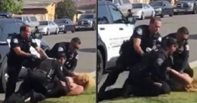 Video Shows Police Officer Brutally Punching Handcuffed Woman In Face During Arrest While His Colleagues Try To Stop Him